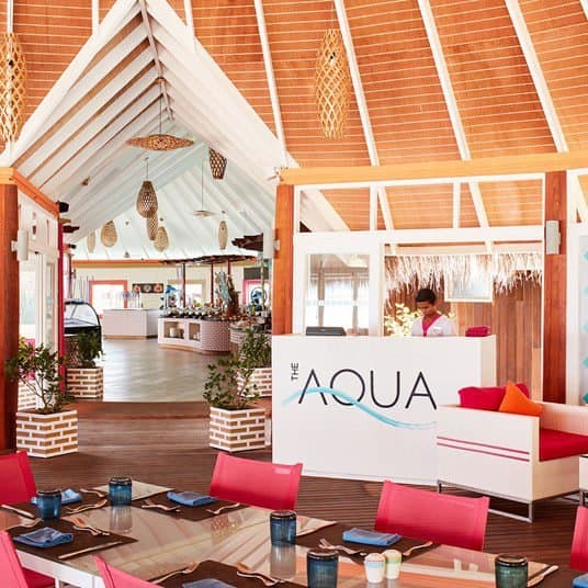 The Aqua - Sophisticated fine dining restaurant at Sun Siyam Vilu Reef featuring elegant tropical ambiance and gourmet cuisine