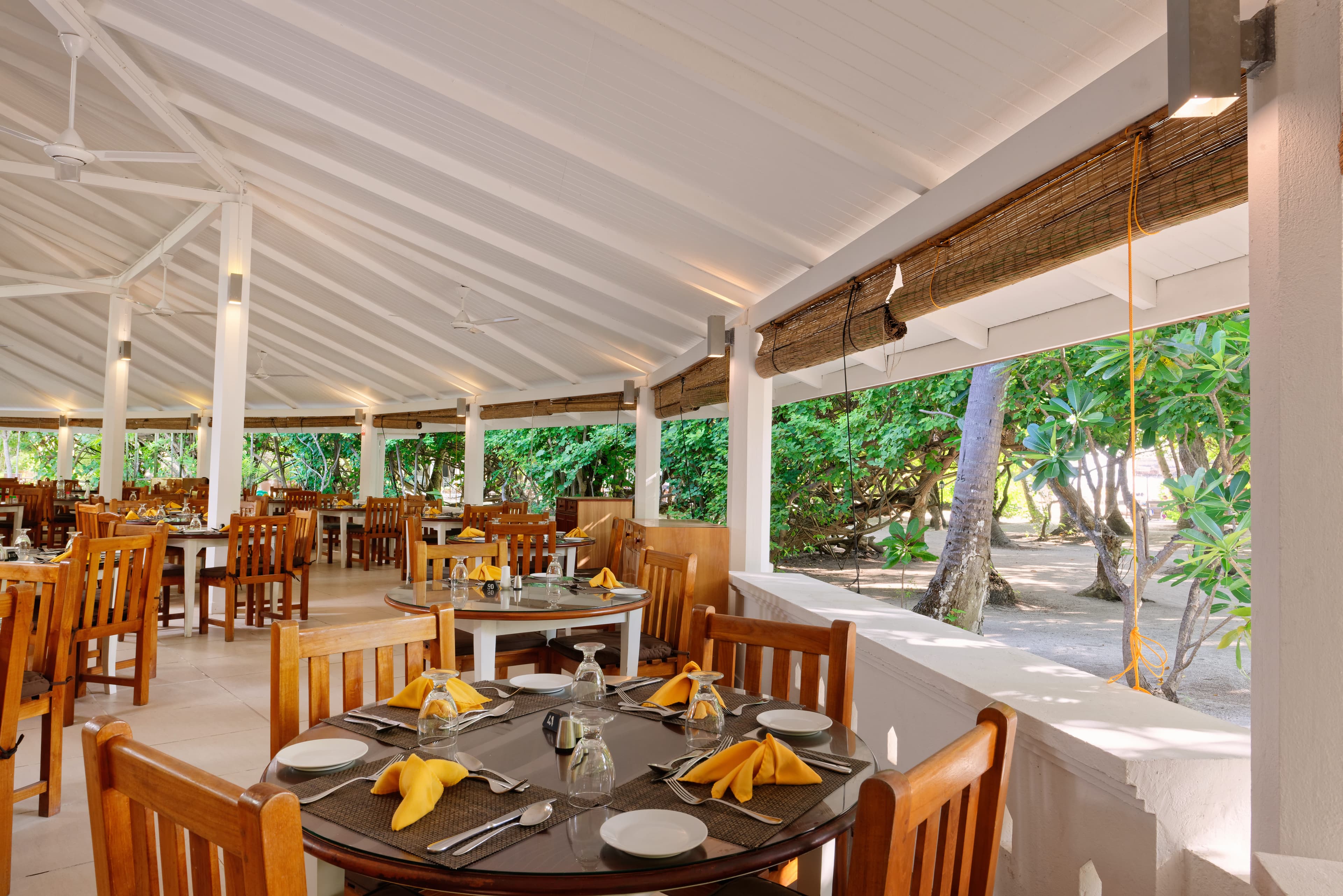 Main Restaurant - Sophisticated International · Asian · Maldivian restaurant at Embudu Village featuring elegant tropical ambiance and gourmet cuisine