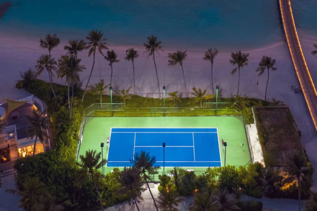 Beachside Tennis - State-of-the-art localbusiness facility at Jumeirah Olhahali Island Maldives with luxurious tropical surroundings and premium amenities