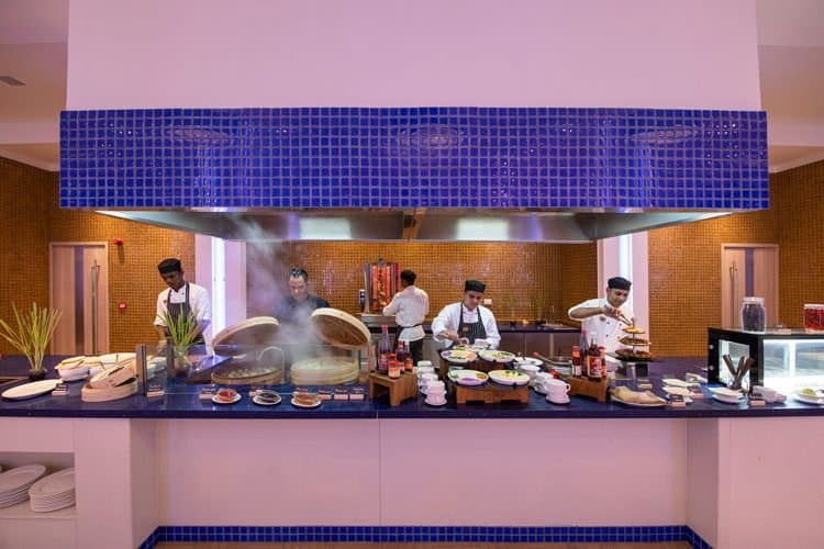 Aqua Restaurant - Sophisticated International Buffet restaurant at Emerald Maldives Resort & Spa featuring elegant tropical ambiance and gourmet cuisine