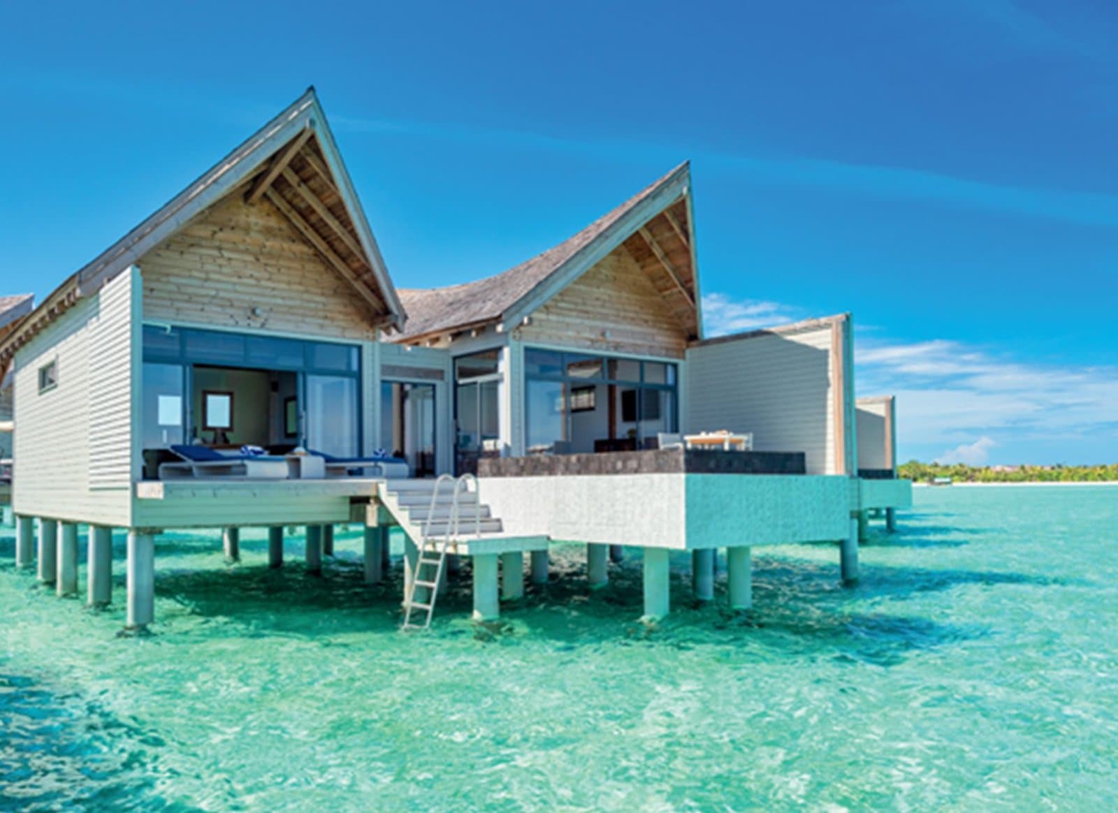 Overwater Pool Villa Sunrise - Elegant 1-guest oceanfront accommodation at Kuredhivaru Resort & Spa Maldives featuring premium furnishings and stunning Maldives views