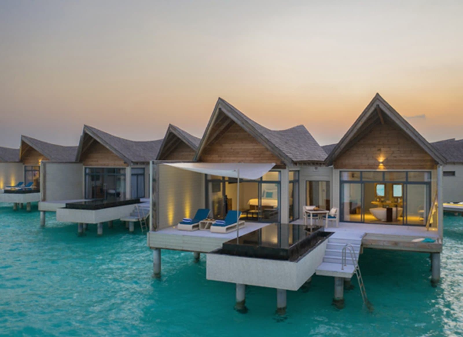 Overwater Pool Villa Ocean - Elegant 1-guest oceanfront accommodation at Kuredhivaru Resort & Spa Maldives featuring premium furnishings and stunning Maldives views
