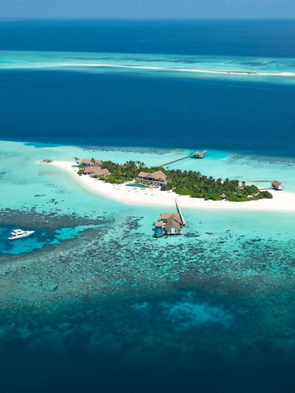 Four Seasons Private Island Maldives at Voavah - 5-star resort in Baa Atoll featuring pristine beaches, crystal-clear lagoon, and overwater villas