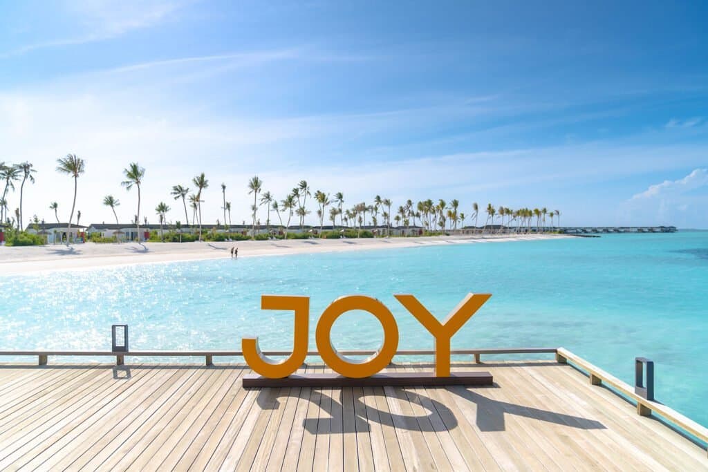 Joy Island Maldives - 5-star resort in Baa Atoll featuring pristine beaches, crystal-clear lagoon, and overwater villas