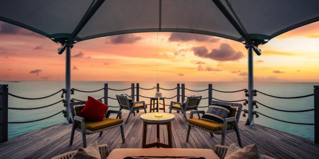 The Sunset Bar - Sophisticated Champagne Cocktails & Canapés restaurant at InterContinental Maldives Maamunagau Resort featuring elegant tropical ambiance and gourmet cuisine